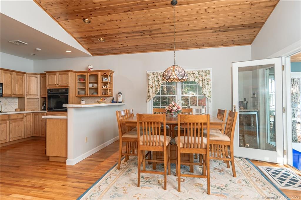 246 North Shore Road Killingly, CT 06241 - Photo 9 of 28 a view of a dining room with furniture and wooden floor