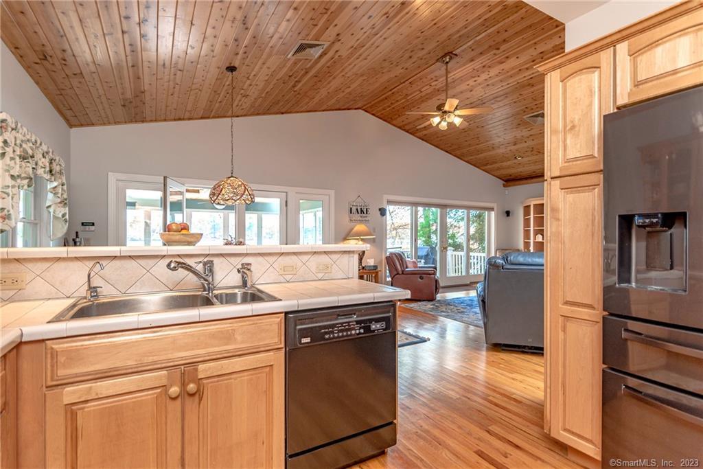 246 North Shore Road Killingly, CT 06241 - Photo 10 of 28 a kitchen with a sink cabinets and wooden floor