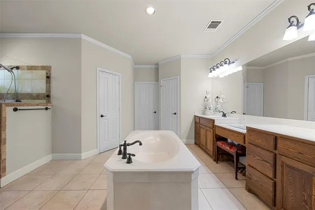 a bathroom with a sink vanity and mirror