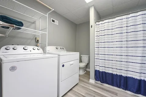a utility room with dryer and washer
