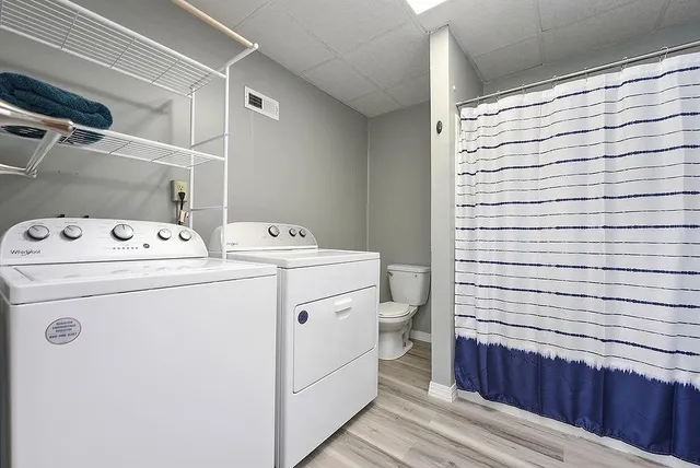 a utility room with dryer and washer