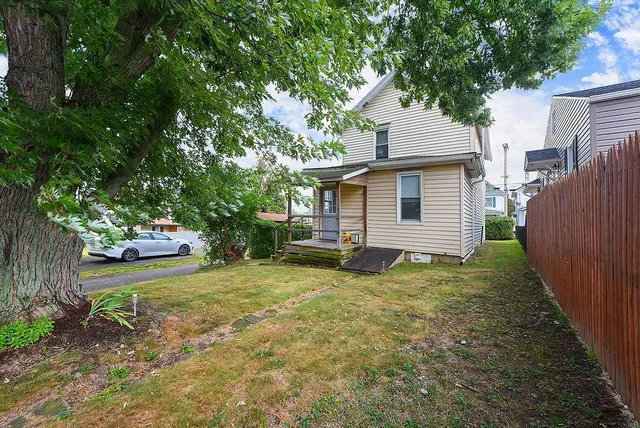 a view of a backyard with a small cabin