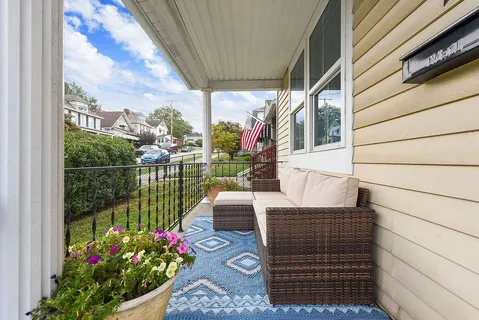 a view of a porch with furniture