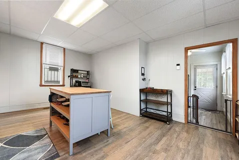 a room with furniture and wooden floor