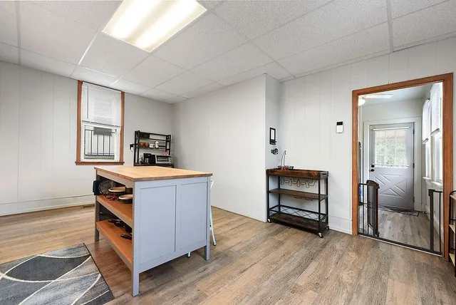a room with furniture and wooden floor
