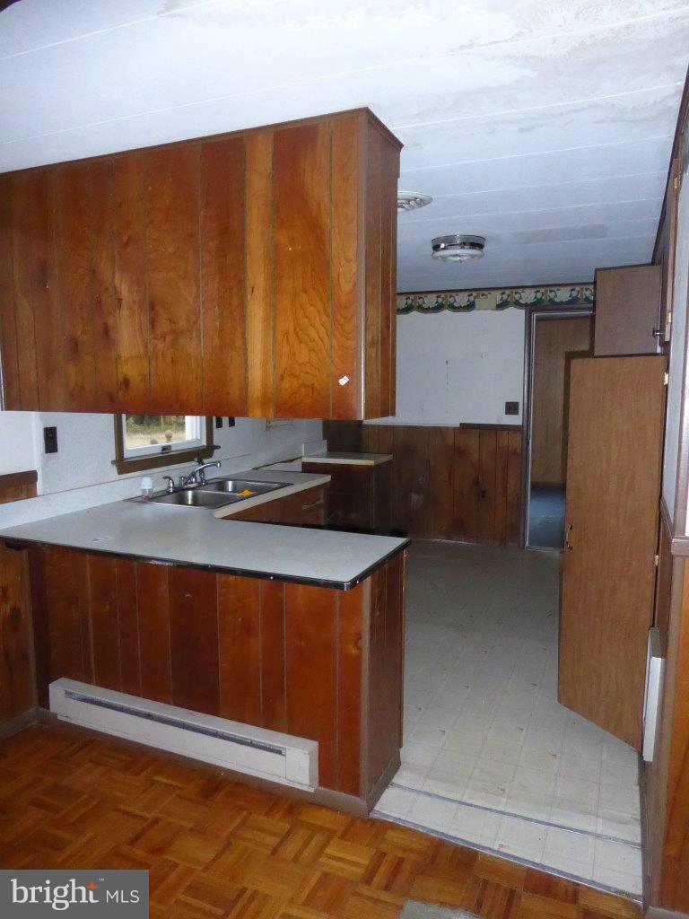 21362 Nanticoke Road Tyaskin, MD 21865 - Photo 4 of 16 a kitchen with a sink and a refrigerator