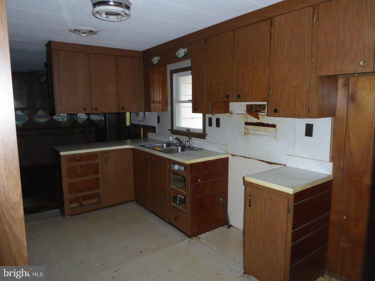 21362 Nanticoke Road Tyaskin, MD 21865 - Photo 5 of 16 a kitchen with sink a stove and cabinets