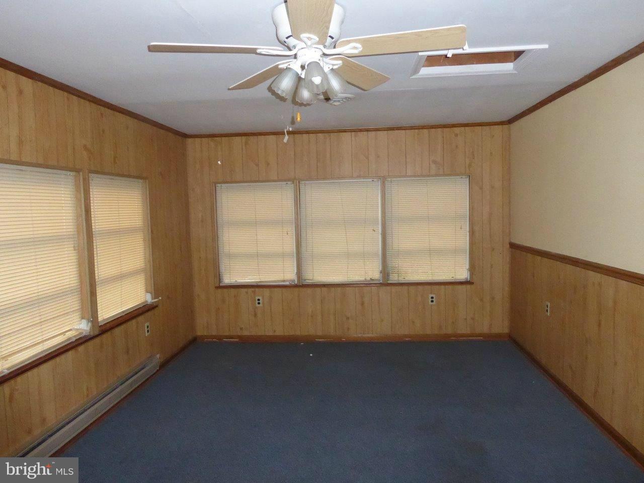 21362 Nanticoke Road Tyaskin, MD 21865 - Photo 6 of 16 en empty room with windows and ceiling fan