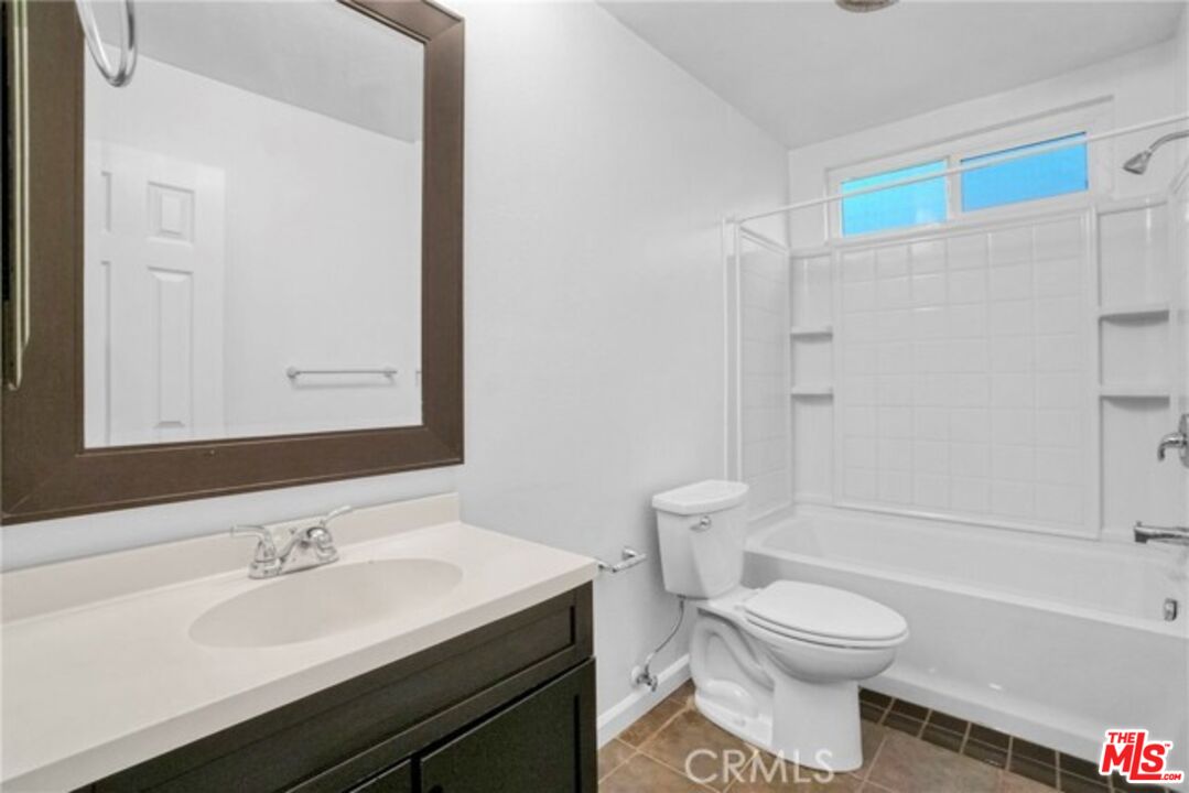 5003 Tilden Avenue, Unit 109 Sherman Oaks, CA 91423 - Photo 18 of 29 a bathroom with a sink a toilet and a bathtub