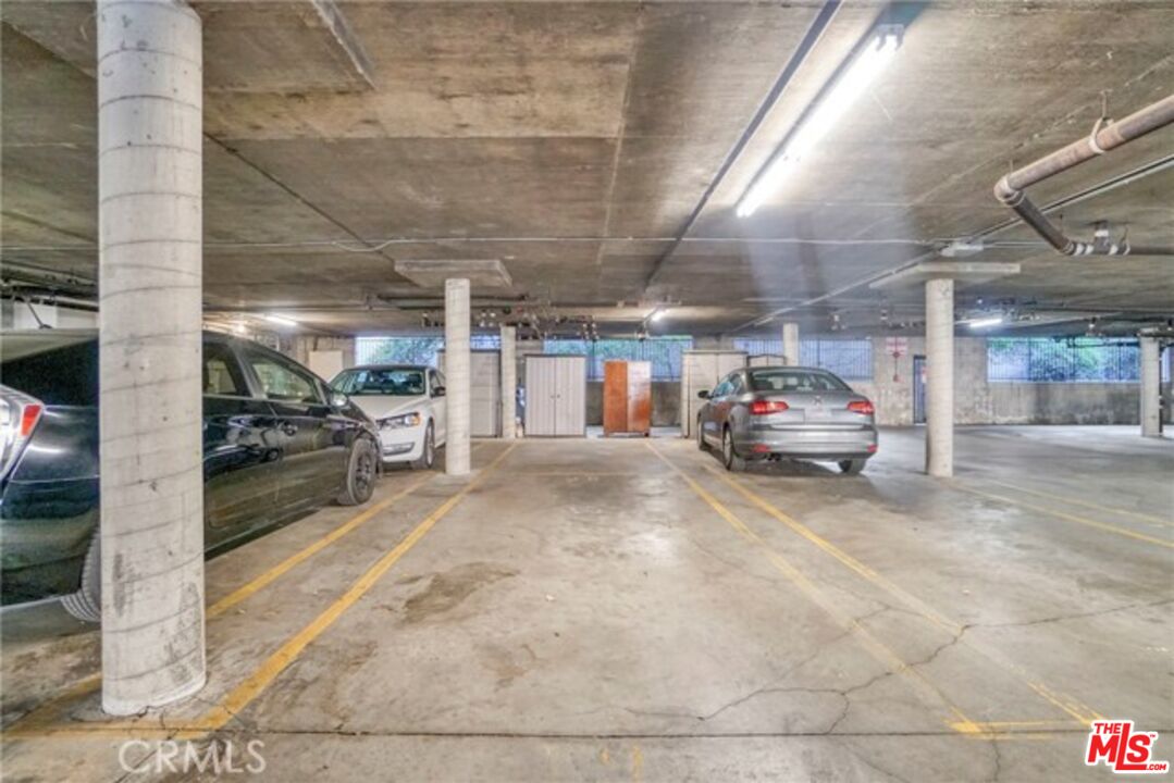5003 Tilden Avenue, Unit 109 Sherman Oaks, CA 91423 - Photo 28 of 29 a view of parking garage with cars