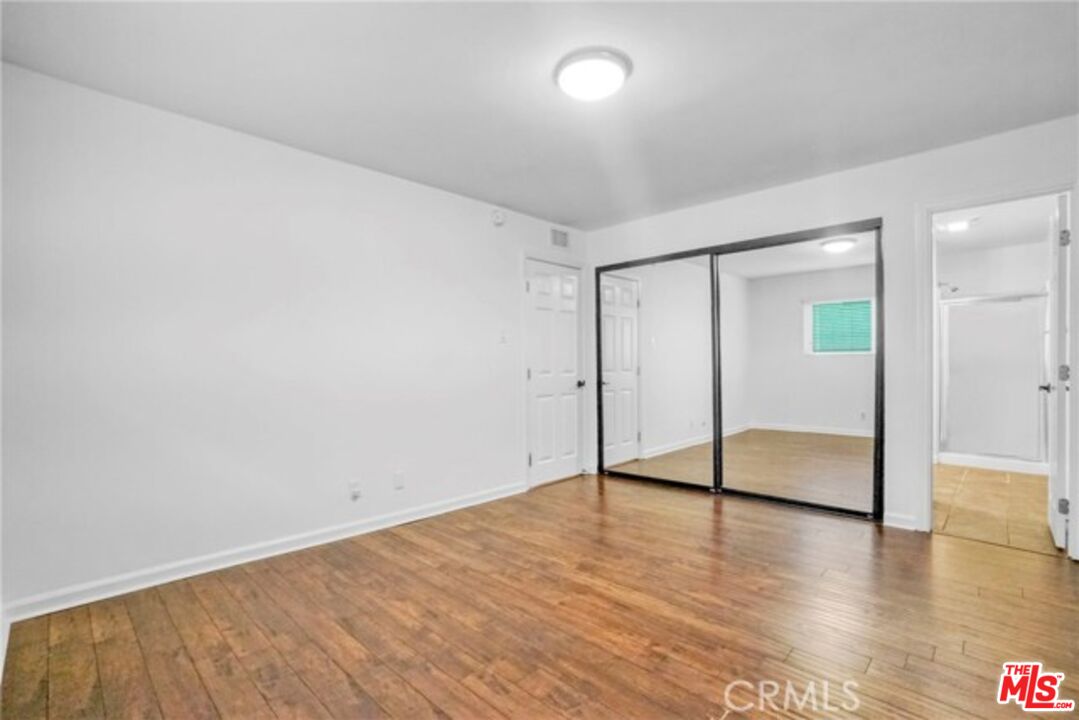 5003 Tilden Avenue, Unit 109 Sherman Oaks, CA 91423 - Photo 8 of 29 wooden floor in an empty room