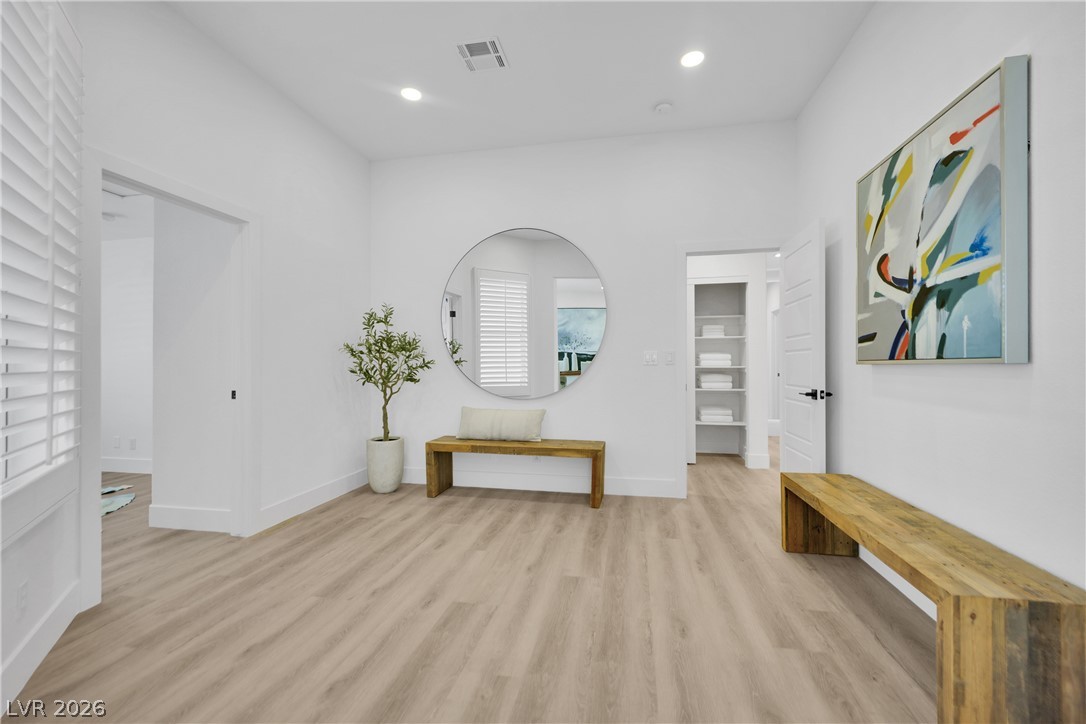 8981 Rivers Edge Drive Las Vegas, NV 89117 - Photo 25 of 69 A well-lit entry with sleek flooring, offering a fresh welcome.