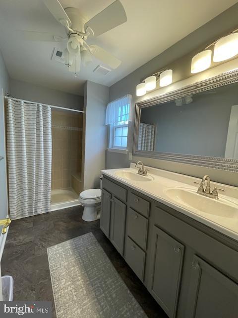 9 Brattleboro Road Swedesboro, NJ 08085 - Photo 17 of 26 a spacious bathroom with a double vanity sink toilet and a shower