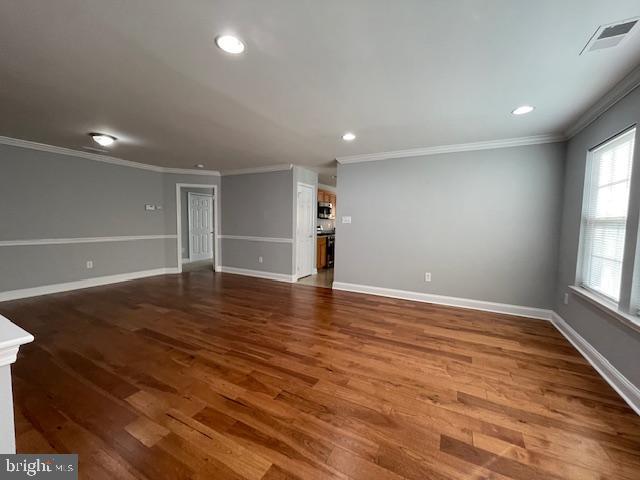 9 Brattleboro Road Swedesboro, NJ 08085 - Photo 4 of 26 an empty room with wooden floor and windows