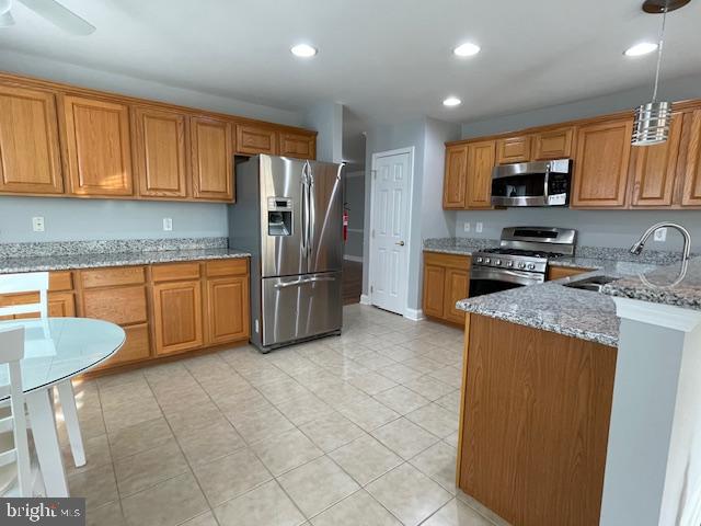 9 Brattleboro Road Swedesboro, NJ 08085 - Photo 7 of 26 a kitchen with stainless steel appliances granite countertop a refrigerator sink and cabinets