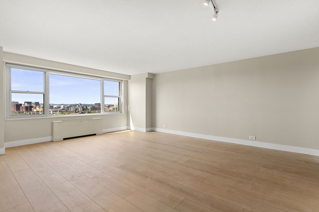 151 Tremont Street, Unit 23P Boston, MA 02111 - Photo 3 of 35 a view of an empty room with a window