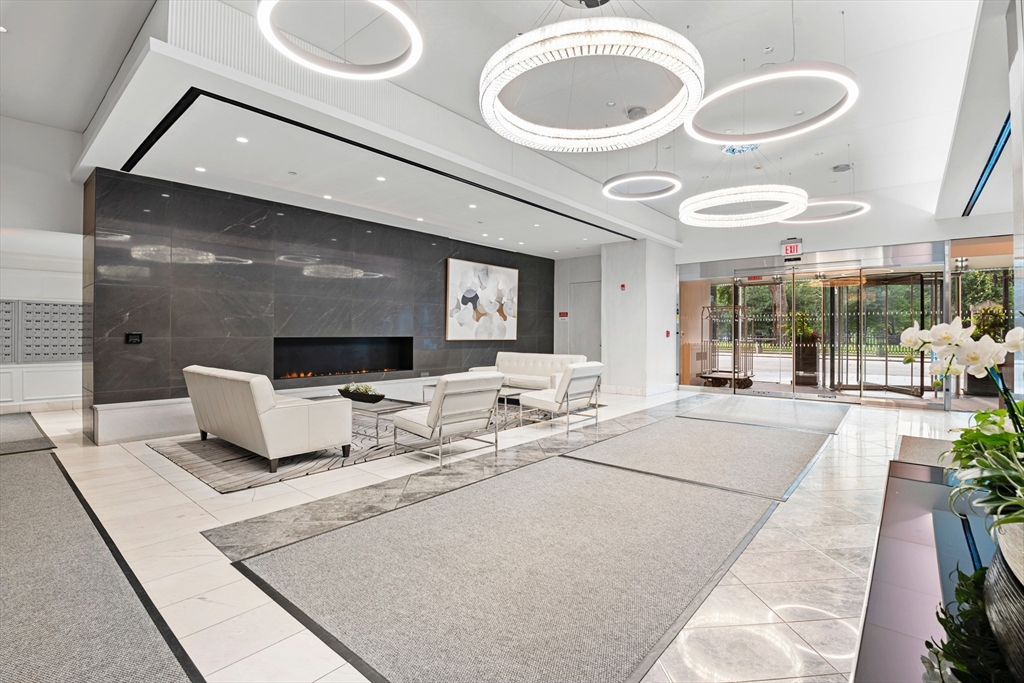 151 Tremont Street, Unit 23P Boston, MA 02111 - Photo 34 of 35 a living room with a couch and potted plant