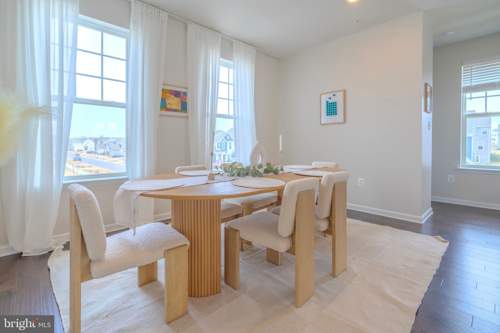 8515 Bald Eagle Lane Frederick, MD 21704 - Photo 17 of 34 a dining room with furniture a window and wooden floor