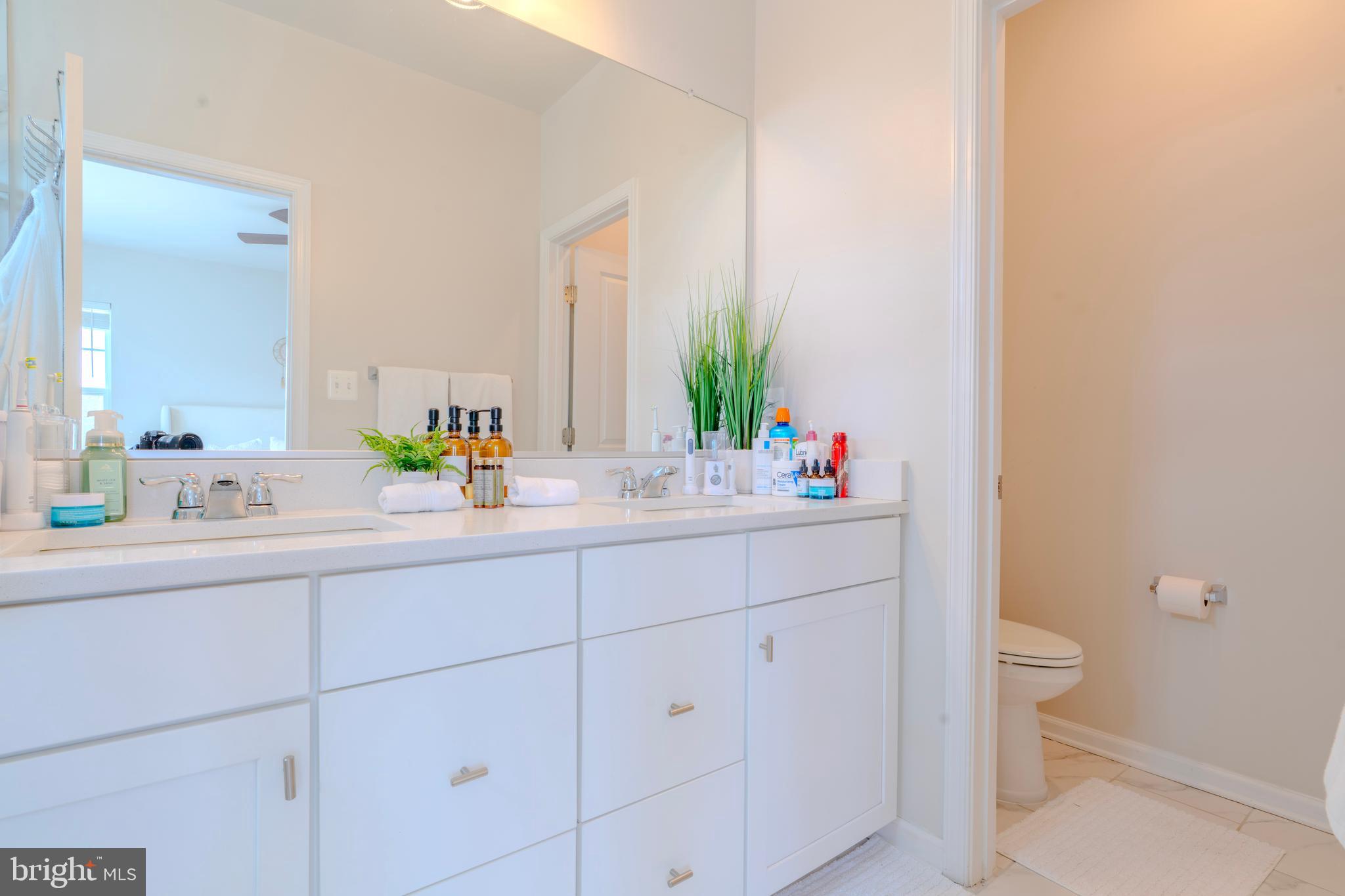 8515 Bald Eagle Lane Frederick, MD 21704 - Photo 24 of 34 a bathroom with a sink and a toilet