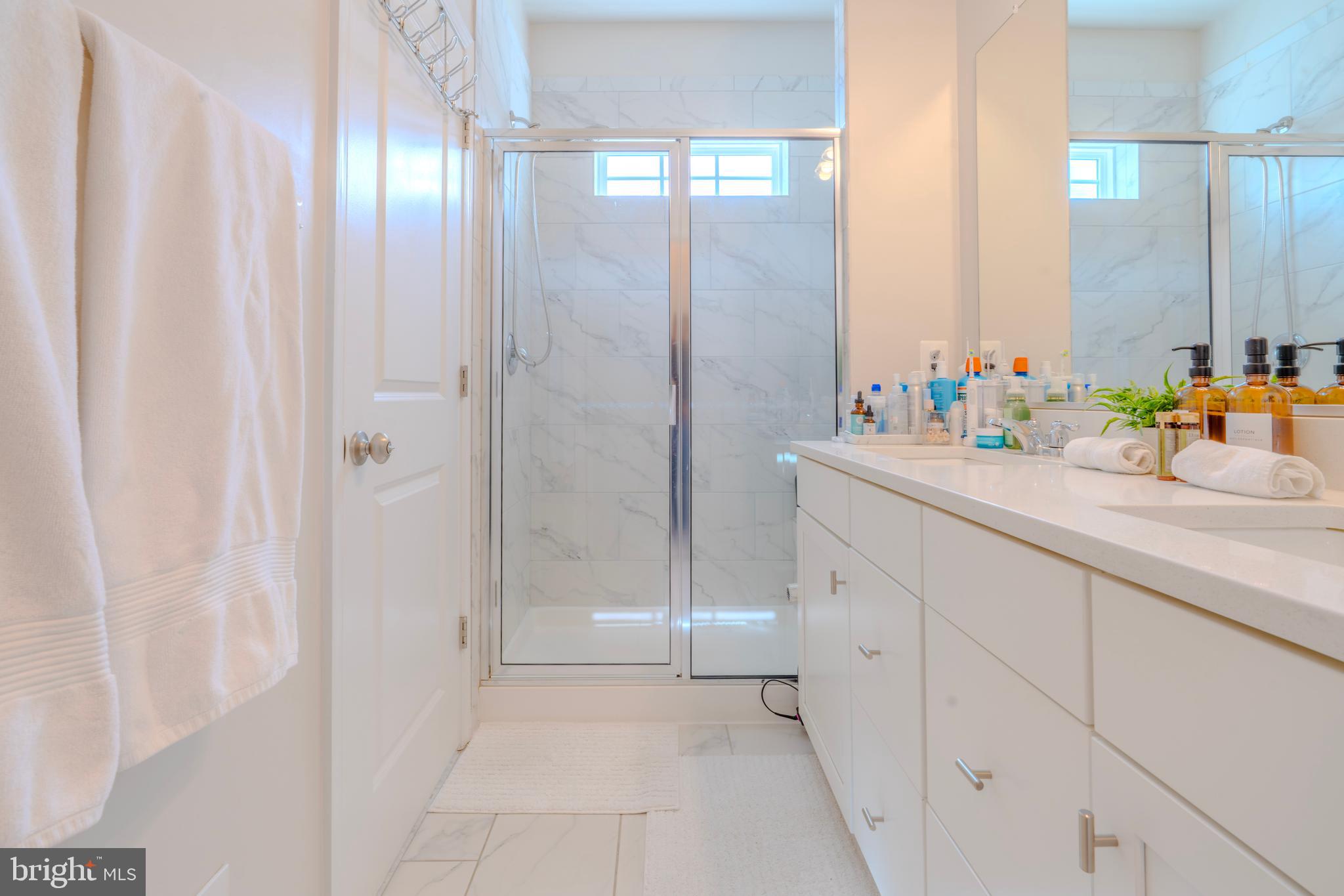 8515 Bald Eagle Lane Frederick, MD 21704 - Photo 25 of 34 a bathroom with a sink and a mirror