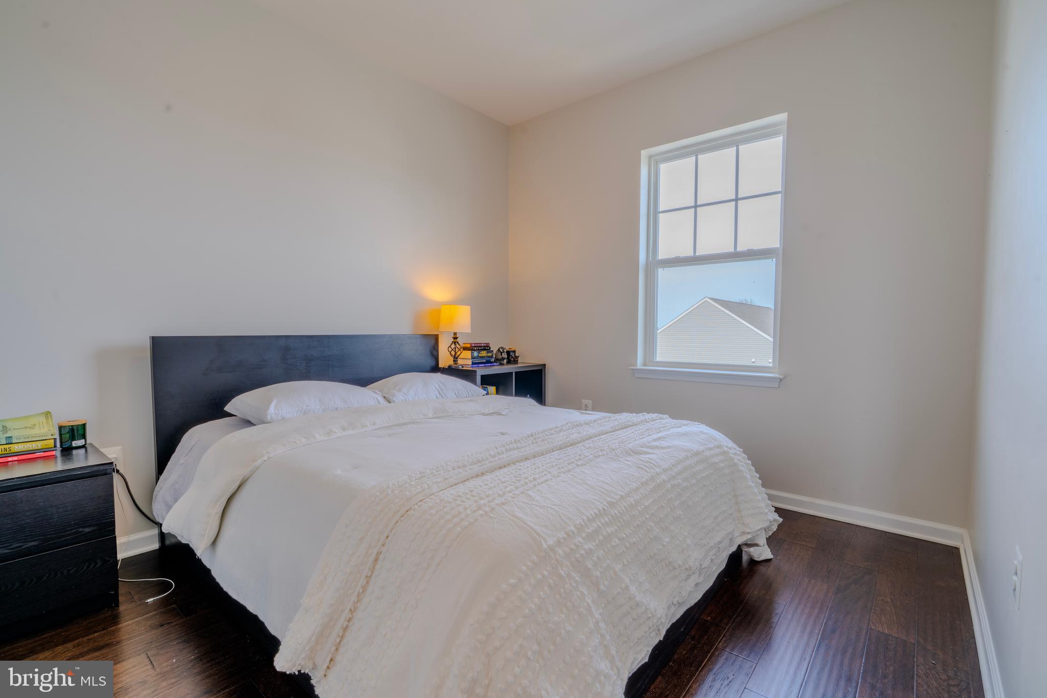 8515 Bald Eagle Lane Frederick, MD 21704 - Photo 28 of 34 a bedroom with a bed a dresser and a window