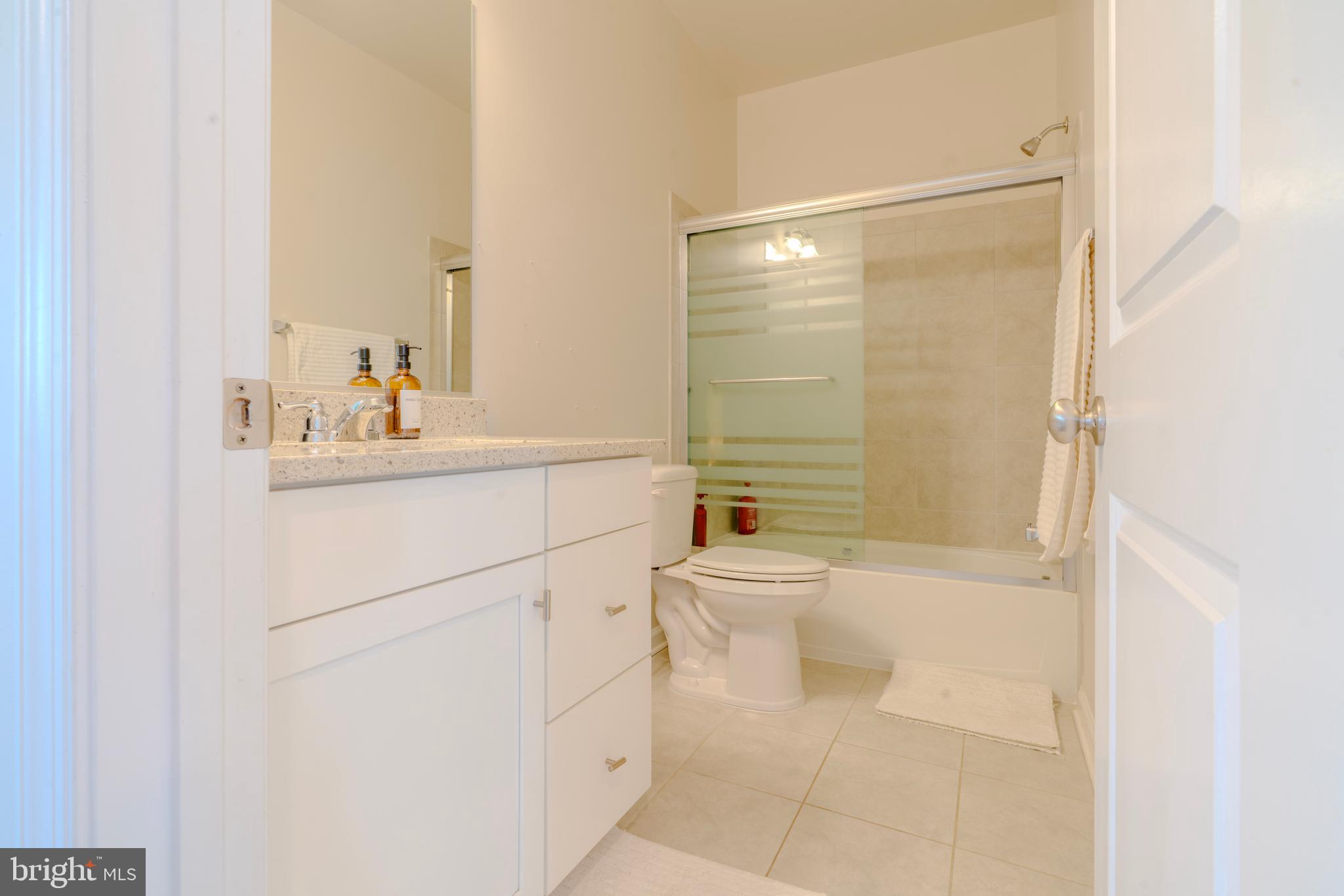 8515 Bald Eagle Lane Frederick, MD 21704 - Photo 30 of 34 a bathroom with a sink a toilet and shower