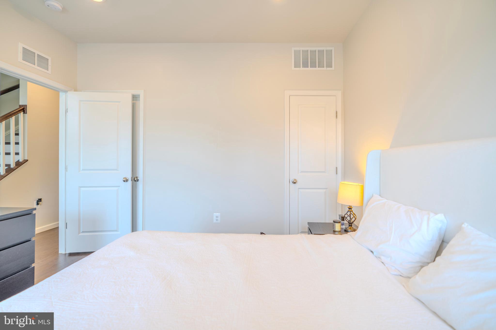 8515 Bald Eagle Lane Frederick, MD 21704 - Photo 5 of 34 a bedroom with a bed and cabinets