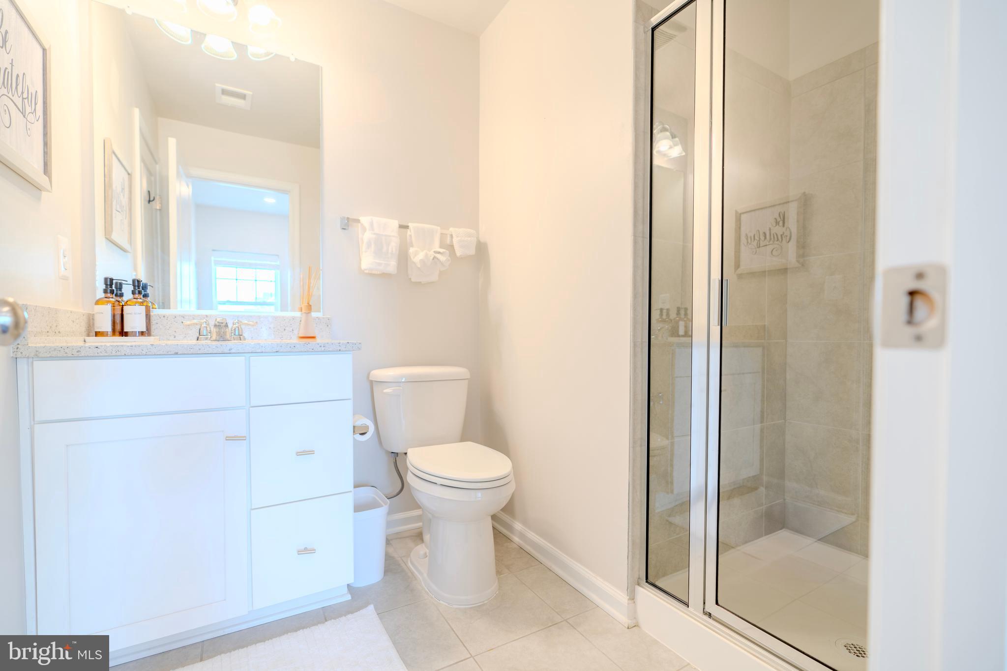 8515 Bald Eagle Lane Frederick, MD 21704 - Photo 7 of 34 a bathroom with a sink a toilet and shower