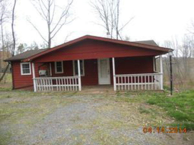 193 Holly Ridge Road Mount Jackson, VA 22842 - Photo 1 of 12 a porch with a small yard