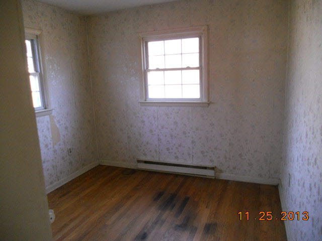 193 Holly Ridge Road Mount Jackson, VA 22842 - Photo 9 of 12 an empty room with wooden floor and windows