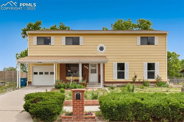 a front view of a house with yard