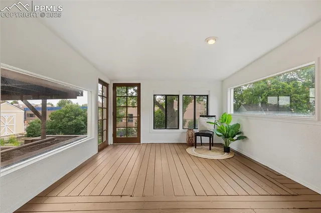 a view of house with porch and wooden floor