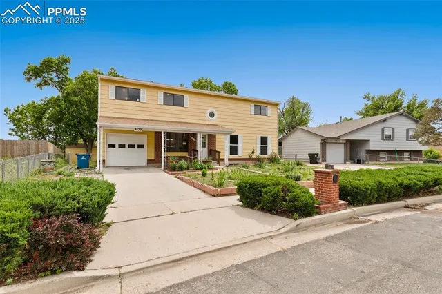 front view of a house with a street