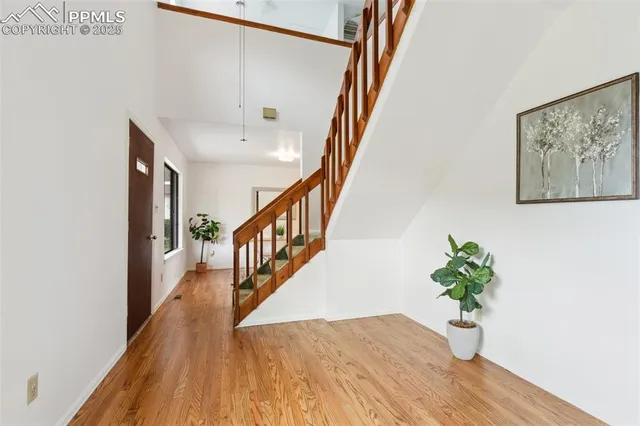 a view of entryway with wooden floor
