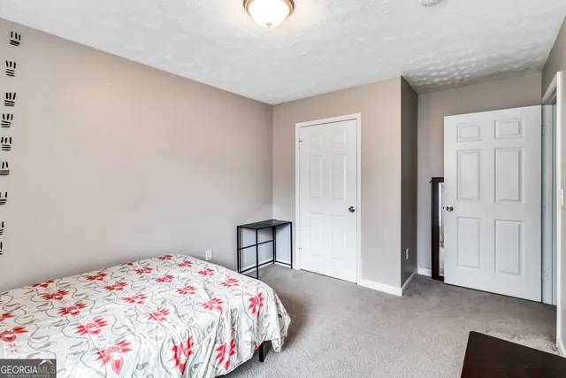 a bedroom with a bed and a cabinets