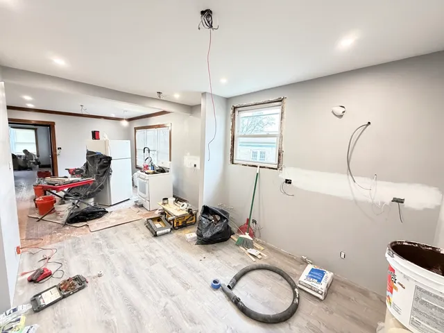 a room with gym equipment and a window