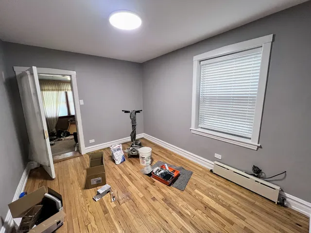 a bed room with a bed and a window