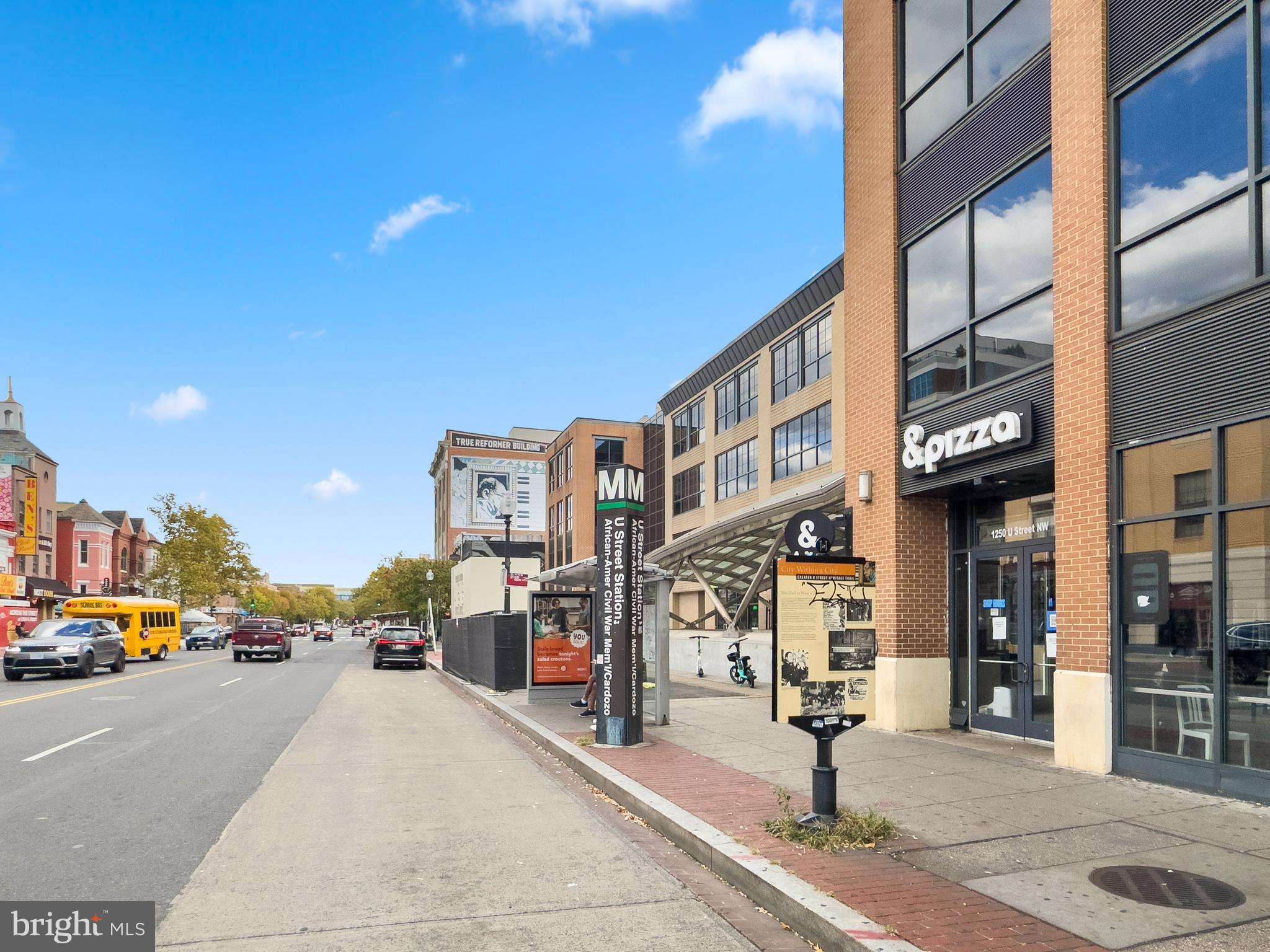 2001 16th Street Northwest, Unit 404 Washington, DC 20009 - Photo 16 of 17 a city street lined with buildings and cars parked on the street