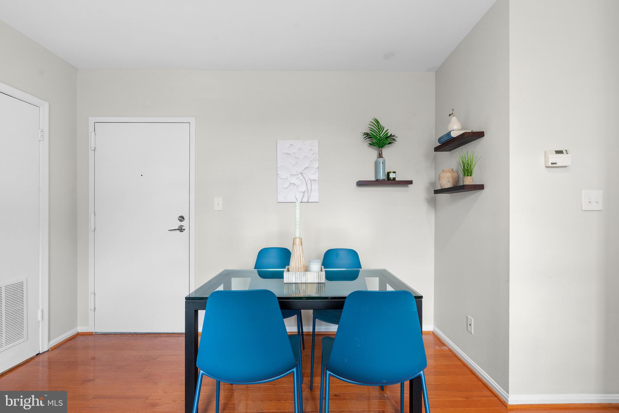 2001 16th Street Northwest, Unit 404 Washington, DC 20009 - Photo 6 of 17 a view of a dining room with furniture and wooden floor