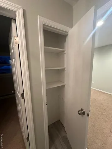 a view of a hallway view with staircase