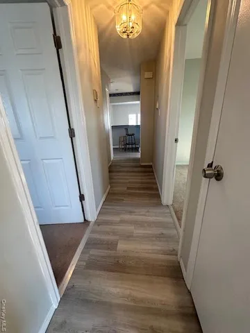 a picture of a bench in front of a wall