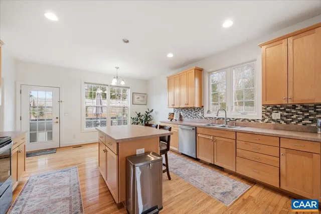 a view of a dining room with furniture and a potted plant