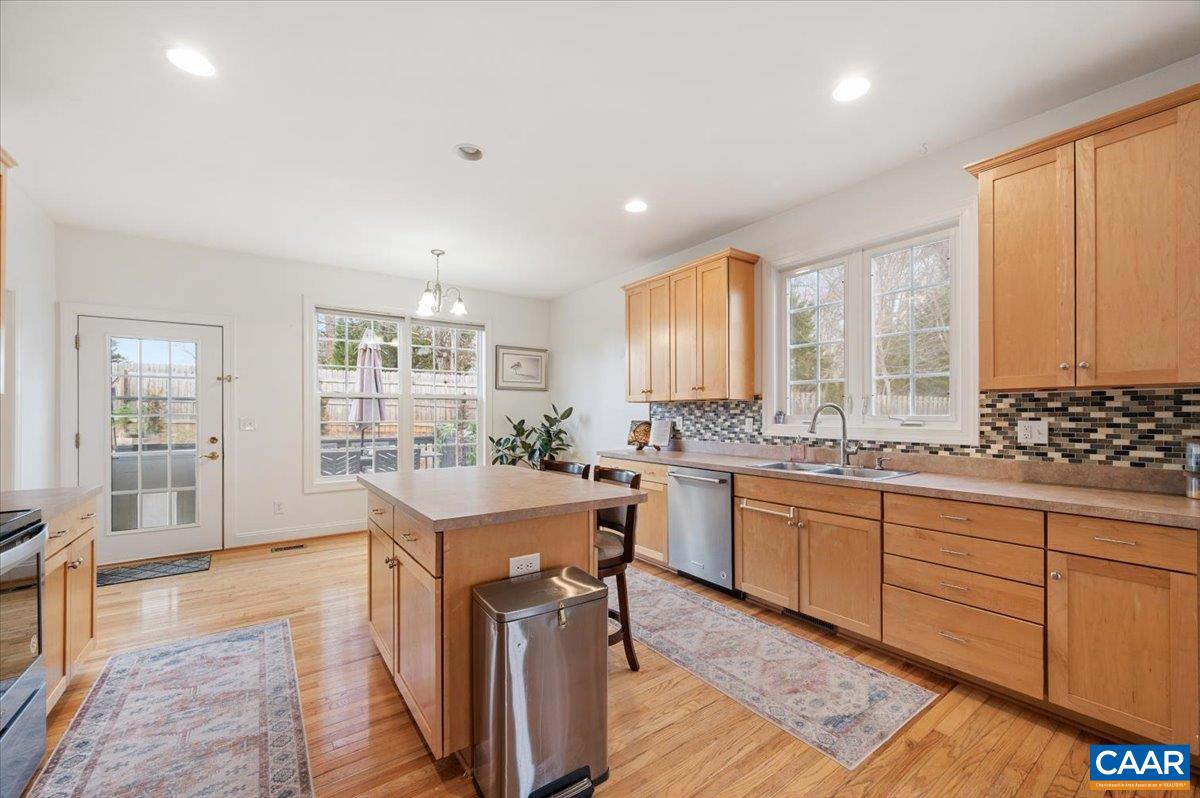 1375 Amber Ridge Road Charlottesville, VA 22901 - Photo 17 of 48 a kitchen with granite countertop a sink stove and cabinets