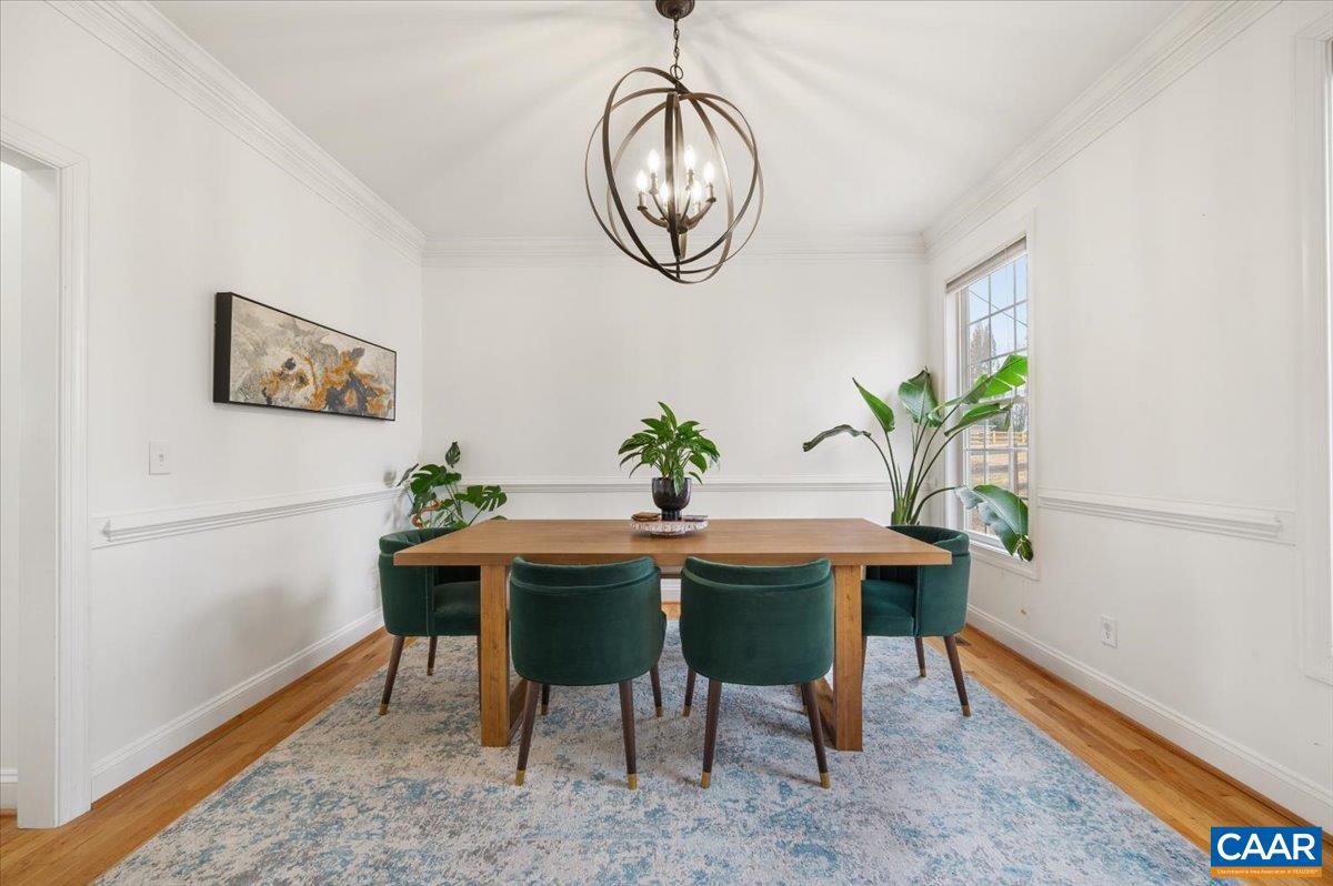 1375 Amber Ridge Road Charlottesville, VA 22901 - Photo 25 of 48 a view of a dining room with furniture and a potted plant