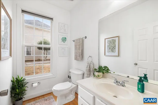 a view of a roof deck with table and chairs with wooden floor and fence