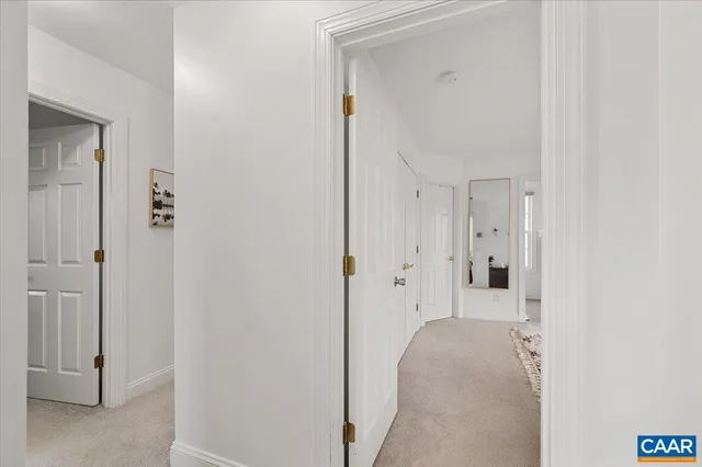 a view of house with swimming pool and a yard