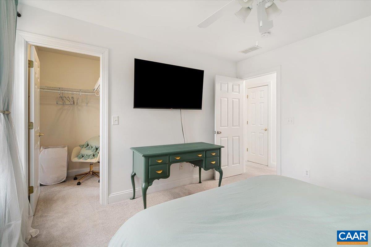 1375 Amber Ridge Road Charlottesville, VA 22901 - Photo 38 of 48 a living room with furniture and a flat screen tv
