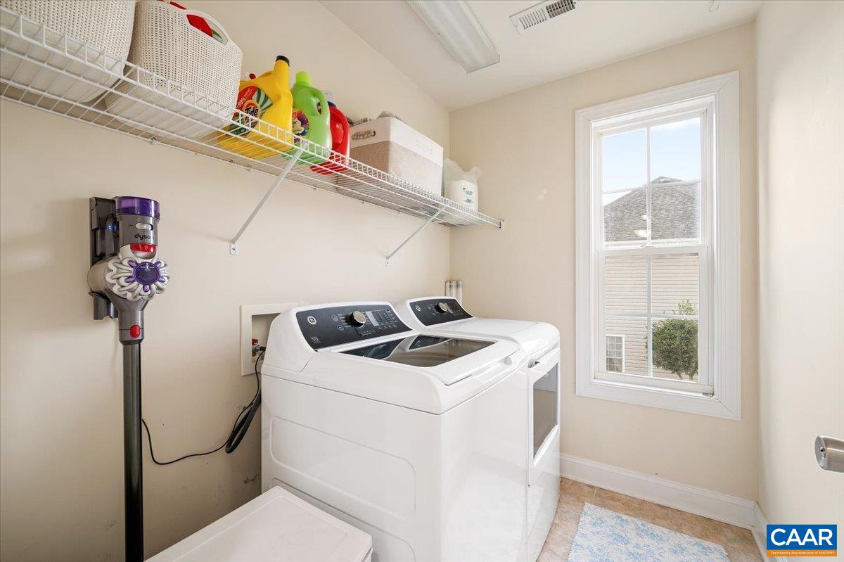 1375 Amber Ridge Road Charlottesville, VA 22901 - Photo 42 of 48 a utility room with dryer washer and a window