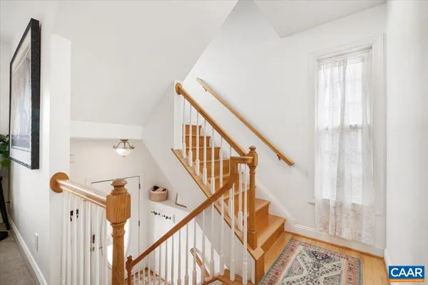 a view of entryway with wooden floor