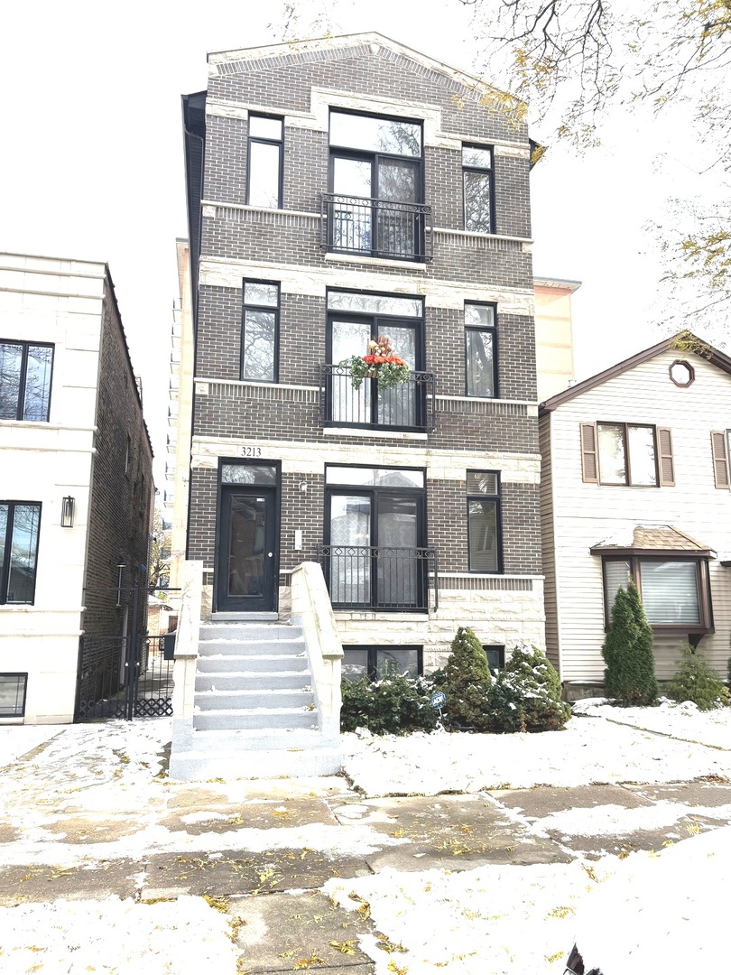 3213 South Wells Street, Unit 1 Chicago, IL 60616 - Photo 2 of 28 a front view of a building with a garden